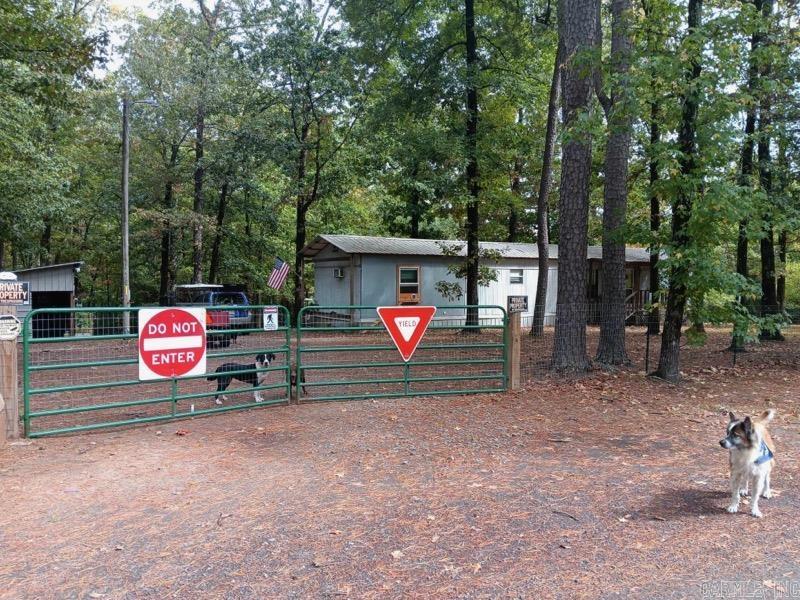 Nice home just across from the beautiful Greers Ferry Lake. Fully fenced 1.5 acre parcel complete with shop/animal barn and lovely back porch for entertaining or enjoying the wildlife. Come enjoy the area full time or just have a great get away place.