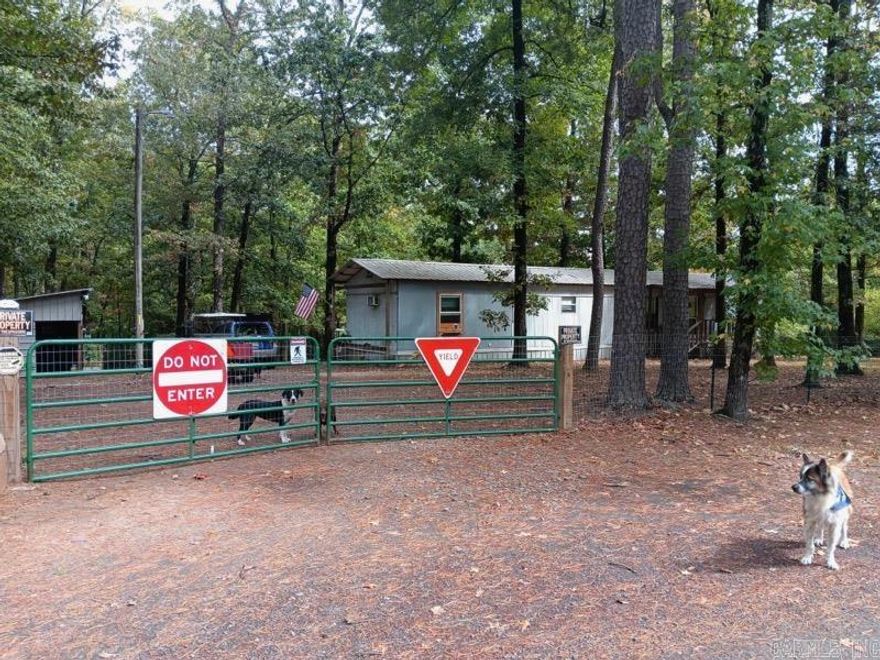 Nice home just across from the beautiful Greers Ferry Lake.  Fully fenced 1.5 acre parcel complete with shop/animal barn and lovely back porch for entertaining or enjoying the wildlife.  Come enjoy the area full time or just have a great get away place.