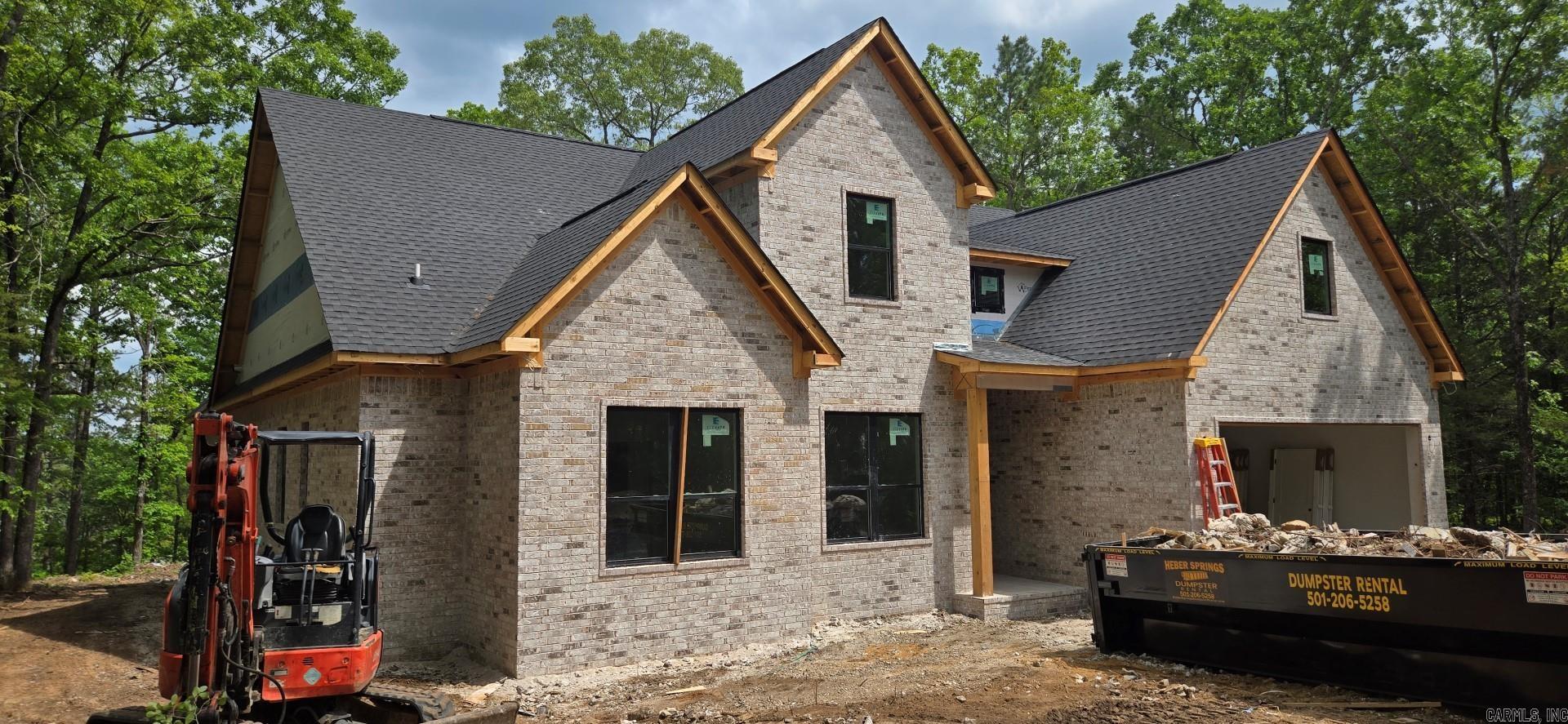 LAKEFRONT HOME WITH 2-SLIP DOCK!!! This new construction (finish date target is Labor Day 2025) will have 2 boat slips directly behind the house! The dock will be just like the one on the photos! 5-bedrooms, 4-baths. 2 living areas, very large covered back patio, great lake views, wood-burning fireplace, easy walk to the lake, gated subdivision, great cove for swimming and much more. Taxes and Subdivision fee are not yet determined. Don't miss this opportunity for a NEW HOME and a NEW DOCK!!! See photos for: plans and specs, great aerial pics, dock pictures, gated entry and more! Seller is open to customization!