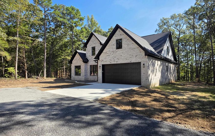 BRAND NEW LAKEFRONT HOME WITH 2-SLIP DOCK!!!  The boat dock will be just like the one in the photos and it will be located directly behind the house!  5-bedrooms, 4-baths, 2 living areas, very large covered back patio, great lake views, wood-burning fireplace, easy walk to the lake, gated subdivision, great cove for swimming and much more!  Taxes and Subdivision fee are not yet determined.  Don't miss this opportunity for a NEW HOME and a NEW DOCK!!!  See photos for:  plans and specs, great aerial pics, dock pictures, gated entry and more!