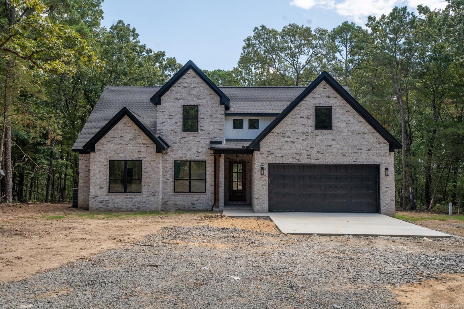 BRAND NEW LAKEFRONT HOME WITH 2-SLIP DOCK!!! The boat dock will be just like the one in the photos and it will be located directly behind the house! 5-bedrooms, 4-baths, 2 living areas, very large covered back patio, great lake views, wood-burning fireplace, easy walk to the lake, gated subdivision, great cove for swimming and much more! Taxes and Subdivision fee are not yet determined. Don't miss this opportunity for a NEW HOME and a NEW DOCK!!! See photos for: plans and specs, great aerial pics, dock pictures, gated entry and more!