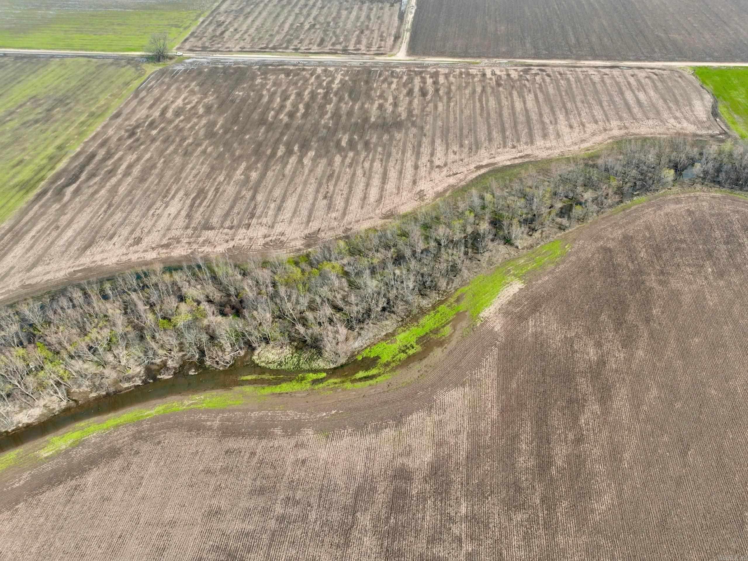 Once-in-a-Lifetime River Valley Investment Opportunity Discover the true essence of the American Dream with this remarkable property located in the heart of the River Valley. Offering both income potential and exceptional recreation, this land is as versatile as it is beautiful. The property features rich, tillable acreage ideal for row crop production, supported by fertile soil and ample water resources. Its proximity to Alma and easy access to I-40 make it an excellent choice for agricultural operations and those seeking to meet the growing demand for locally sourced, sustainable food. For the outdoor enthusiast, the land is equally impressive. Crooked Slough runs directly through the property, providing prime habitat for deer, duck, and other wildlife. With Frog Bayou Wildlife Management Area and the Arkansas River nearby, world-class hunting and recreation opportunities are right at your doorstep. With multiple access points, unbeatable location, and endless possibilities, this property is a rare chance to invest in a legacy piece of land.
