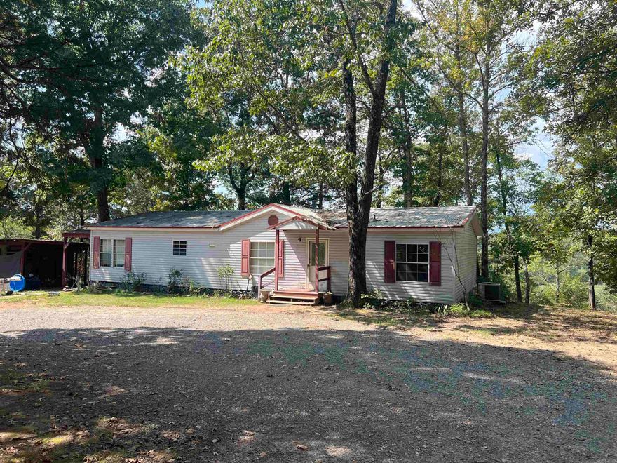 if you want a beautiful home on 20 acres of peace and quiet, this mobile is for you. Stunning views of Pee Dee creek with access to the creek. Creek has access to Greers Ferry Lake when water is up. Tons of wildlife that will walk through your yard. Storage shed with covered parking. Storm shelter. Plenty of room to add on or build a new home. Call today to view this amazing property.