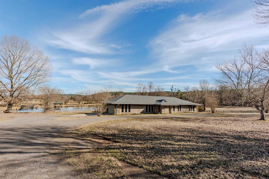 Country home sitting on 5 acres of unrestricted and tons of space! Large family? This home is spacious with 4 bedrooms 2.5 bathrooms and a large bonus room that could be utilized as a 5th bedroom if needed. You will own part of the pond that sits behind the house and it is already stocked with bass and crappie! Let's talk new: 2025 new roof, 2025 new HVAC, 2026 new water line from road to house and 2026 new stove. Enjoy country living all while being 25 minutes to Conway and 30 minutes to West Little Rock! Work from home? No problem. This property has fiber internet available!