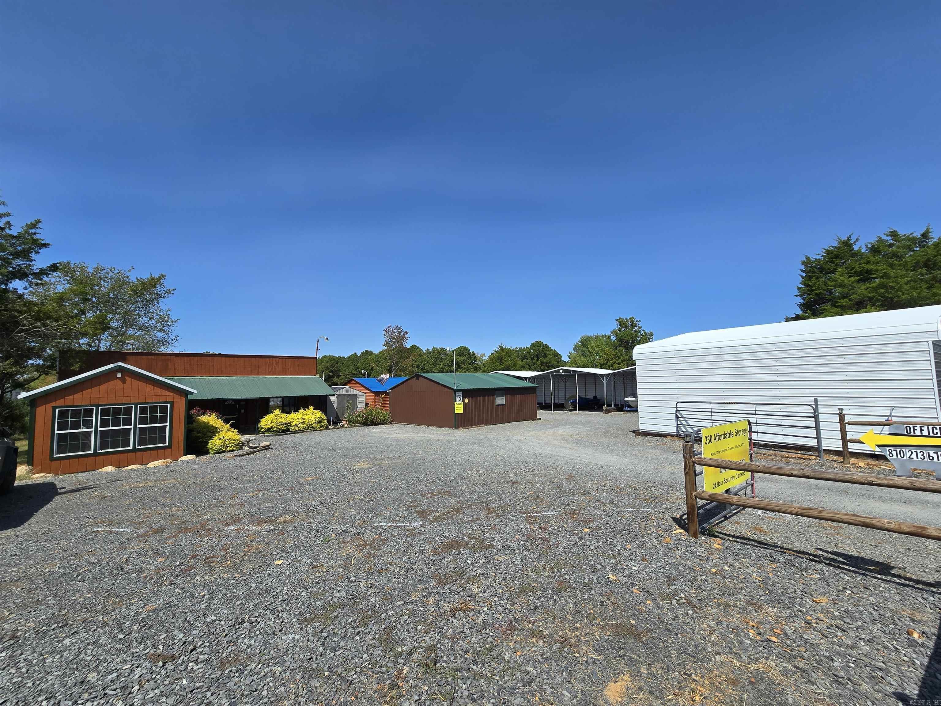 Prime Storage Facility with Growth! Invest in a thriving storage facility located in a rapidly growing area. This well-maintained property offers a stable income stream with ample room for expansion. **Key Features:**Strategic Location:** Situated in a high-demand area, away from any restrictions. Strong Occupancy: 80% occupancy across 31 units, ensuring a consistent income flow., Secure Environment: 24/7 security provides peace of mind for tenants and investors. Versatile Space: Includes a rented warehouse with tenant-paid utilities and a vacant office space for potential rental income. Expansion Potential: The property allows for the addition of approx 30 or outdoor storage units, catering to increasing demand. Modern Amenities:** Solid concrete floors, 220V power in the office and shop building, and individual power to each storage unit and 2 half bathrooms! Affordable Rates: Competitive storage rates starting at $35 per month attract a wide range of tenants leaving plenty of room to grown your income right away & with added storage to rent! **Don't miss this chance to own a profitable and expandable storage facility.** Contact today to schedule your tour!