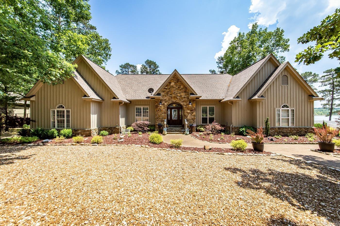 Welcome to your dream lakefront home nestled in the picturesque community of Grand Isle. This property boasts a perfect blend of natural beauty, offering breathtaking views of the serene lake. With its stone fireplace, vaulted ceilings, & a host of other exceptional features, this residence promises an unparalleled living experience. Imagine cozying up by the fireplace on chilly evenings, creating memories with loved ones. The kitchen is a chef's delight, equipped with newer appliances. The den offers a peaceful retreat overlooking the tranquil lake, where you can relax & unwind while immersing yourself in the beauty of nature. One of the highlights of this remarkable property is the screened room that provides an idyllic setting for enjoying the breathtaking lake views. The expansive deck overlooks the glistening lake, offering ample space for entertaining guests. The master suite is a true oasis, featuring an updated master bath with a custom shower. Indulge in the ultimate relaxation as you pamper yourself in this luxurious space. Every detail has been carefully curated to create a sanctuary where you can escape the stresses of everyday life. A boat slip is available for $35,000