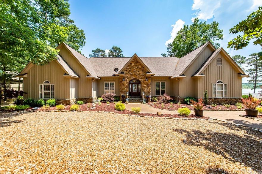 Welcome to your dream lakefront home nestled in the picturesque community of Grand Isle. This property boasts a perfect blend of natural beauty, offering breathtaking views of the serene lake. With its stone fireplace, vaulted ceilings, & a host of other exceptional features, this residence promises an unparalleled living experience. Imagine cozying up by the fireplace on chilly evenings, creating memories with loved ones. The kitchen is a chef's delight, equipped with newer appliances. The den offers a peaceful retreat overlooking the tranquil lake, where you can relax & unwind while immersing yourself in the beauty of nature. One of the highlights of this remarkable property is the screened room that provides an idyllic setting for enjoying the breathtaking lake views. The expansive deck overlooks the glistening lake, offering ample space for entertaining guests. The master suite is a true oasis, featuring an updated master bath with a custom shower. Indulge in the ultimate relaxation as you pamper yourself in this luxurious space. Every detail has been carefully curated to create a sanctuary where you can escape the stresses of everyday life. A boat slip is available for $35,000