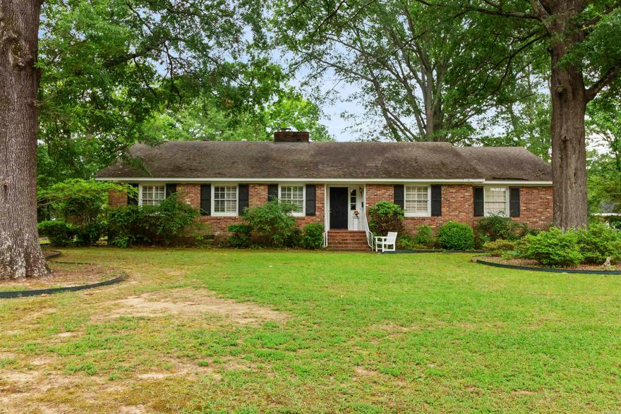 Welcome to 106 N. Hickory st! This delightful property blends historic charm with modern updates, making it the perfect choice for style and convenience. Step inside to a bright living area featuring elegant plantation shutters on most windows. The updated kitchen boasts sleek granite countertops, stainless steel appliances, and ample cabinet space—ideal for any culinary enthusiast. Located in a vibrant area surrounded by numerous renovated homes, this neighborhood offers increasing desirability. Enjoy the convenience of being close to downtown. Additional highlights include a cozy backyard, original hardwood floors, and a charming back patio. Don’t miss the chance to own this beautifully updated brick home in a thriving community. Agents see remarks!