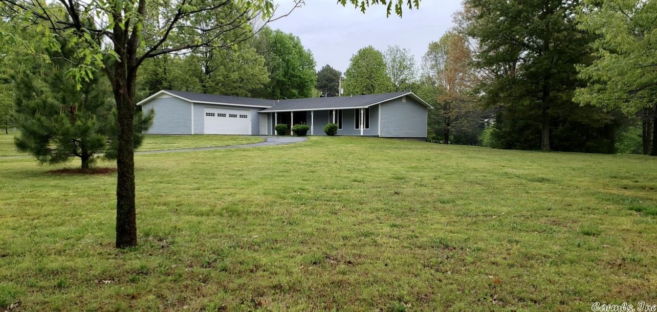 Live your best life in this beautiful, completely remodeled home! Sitting on approximately 2.3 + acres, you'll have the best of both worlds with country views and city amenities. The stunning kitchen is a chef's dream, designed with butcher block island and all stainless steel Whirlpool appliances. Coupled with the expansive living and dining rooms makes this space perfect for entertaining. This home includes an oversized garage with automatic doors on each end and a paved circle driveway. Updated with all new flooring, paint, appliances including refrigerator, light fixtures and ceiling fans, tub and shower units, kitchen and bathroom cabinets, exterior siding and roof in 2021 and central heat and air unit new in 2022. The 2.3 + acres offers endless possibilities for adding on if you want more space or to add a shop building. Stop dreaming and start living!