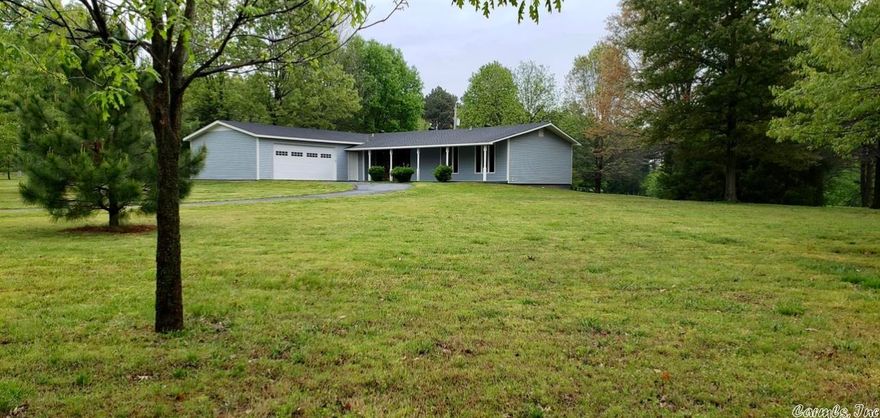 Live your best life in this beautiful, completely remodeled home! Sitting on approximately 2.3 + acres, you'll have the best of both worlds with country views and city amenities. The stunning kitchen is a chef's dream, designed with butcher block island and all stainless steel Whirlpool appliances. Coupled with the expansive living and dining rooms makes this space perfect for entertaining. This home includes an oversized garage with automatic doors on each end and a paved circle driveway. Updated with all new flooring, paint, appliances including refrigerator, light fixtures and ceiling fans, tub and shower units, kitchen and bathroom cabinets, exterior siding and roof in 2021 and central heat and air unit new in 2022. The 2.3 + acres offers endless possibilities for adding on if you want more space or to add a shop building. Stop dreaming and start living!