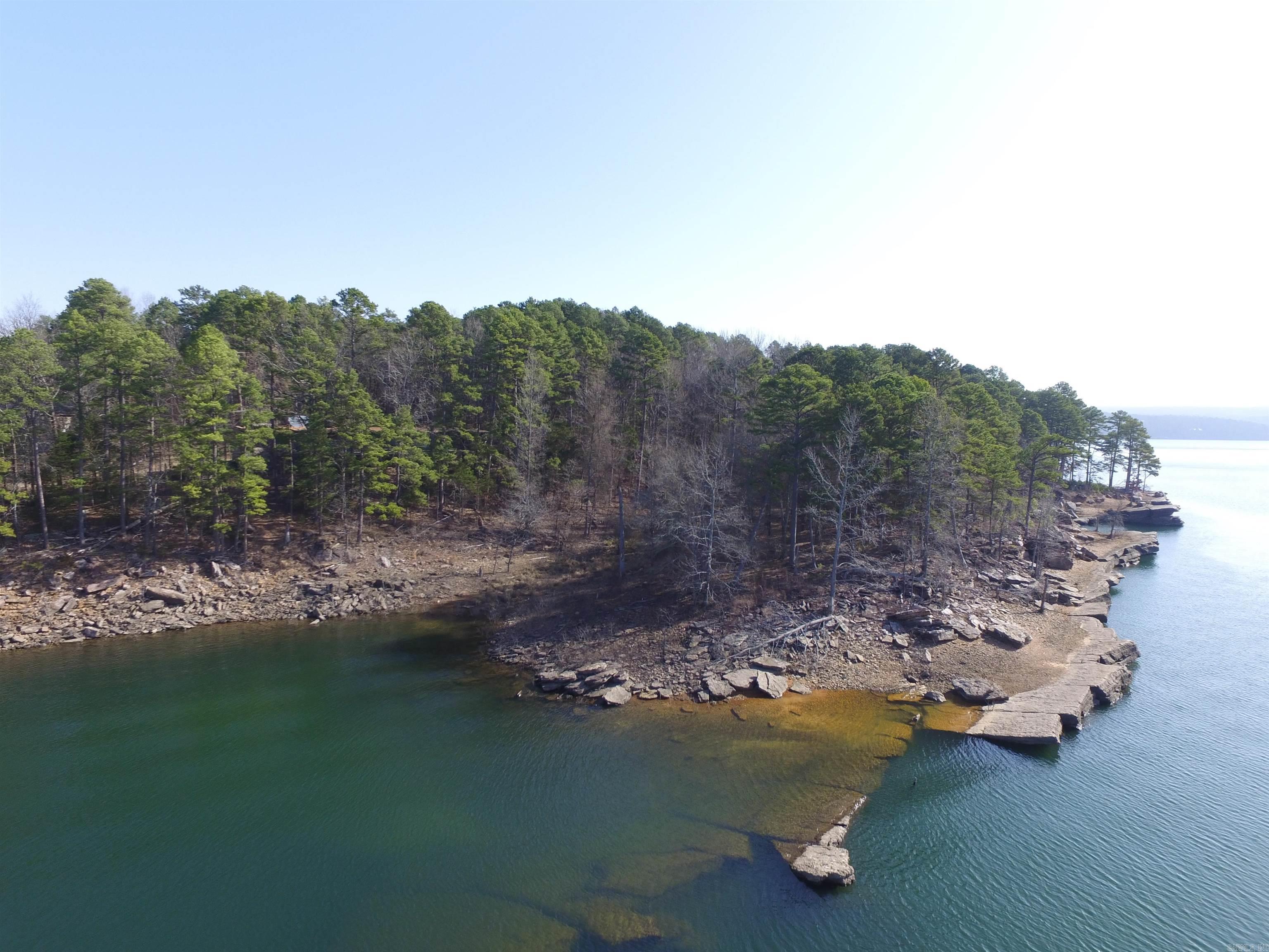 Home with walk out basement, 4bd. 3 ba, 2 car carport, sets on 3 Lake Front Lots, plenty room to build another house or 2 cabins, easy walk to the water, very close to Old Hwy 25 boat ramp.