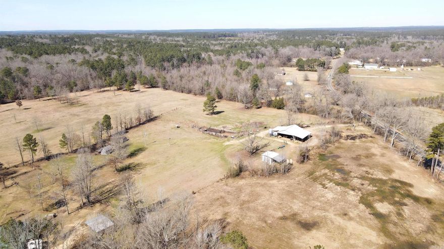 Calling all Ranchers, Cowboys, and Farmers, or anyone who loves the outdoors to this true working cattle/horse ranch just miles from I-30 in Clark County, Arkansas and nearby Oaklawn Racing Resort in Hot Springs. Turn off a paved road, to all the amenities and possibilities. 40x50 Pole Barn with lean-to on each side. NEWLY ADDED 16 X 34 COZY CABIN featuring pine wood flooring and walls w/tin ceiling, kitchen, bath, and laundry room. Exterior features include: 36.82 gorgeous acres with feed bins, feed silos, several outbuildings, sizes included are 10x 12 tractor shed, 10x16 tool/storage shed. 5 Strand Barbed-wire fencing. Squeeze Shoot, Off Shoot, and Corral for working cattle. Pond for watering livestock and also a well with a natural spring. The land has excellent fertile pastures for grazing along with harvesting hay. If your not into farming- the property would also make a great Hunting Retreat! Something to enjoy for the whole family! CALL TODAY for a tour of this unique oasis!