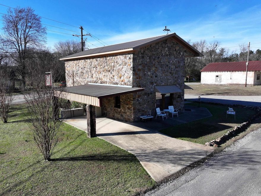 Historic 2-bedroom, 1-bath rock building built in the 1930s, originally serving as the Bank of Caddo Gap. This unique structure retains notable features, including the original vault door now used for the bathroom entry. Positioned on approximately 0.25± acres in Norman, this property offers distinctive architecture and solid construction with a layout suitable for a variety of uses.