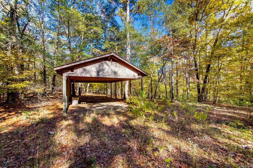 6 Acres located down a short easement rd. & right around the corner from a public concrete boat ramp (Ramp at the end of Leech Rd. and located in the back of Middle Fork part of Greers Ferry Lake).  Pole barn on property and the 6 acres backs up to Corp. of Engineers land for access to the water.  Water and Electric located at Mayhand Rd. and would need to be ran down the utility easement on the right side of the easement rd as you head towards the land).  Plenty of wildlife in this area and no restrictions.