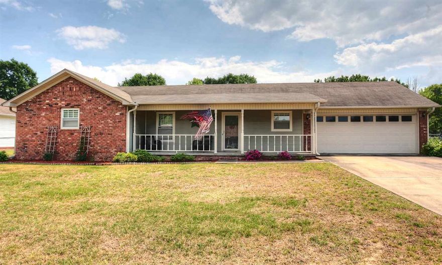 So very cute!  Great curb appeal with long front porch and nice landscaping.  Entry leads you to spacious, sunlit living area with brick woodburning fireplace.  Features include a Large kitchen with tons of cabinets and counterspace and a nice dining area with a bay window.  Large laundry room too!  The master bedroom is plenty big for all of your furniture.  You'll love the backyard with a really nice deck that is perfect for entertaining.  New laminate, carpet, paint, cabinet hardware, light fixtures.