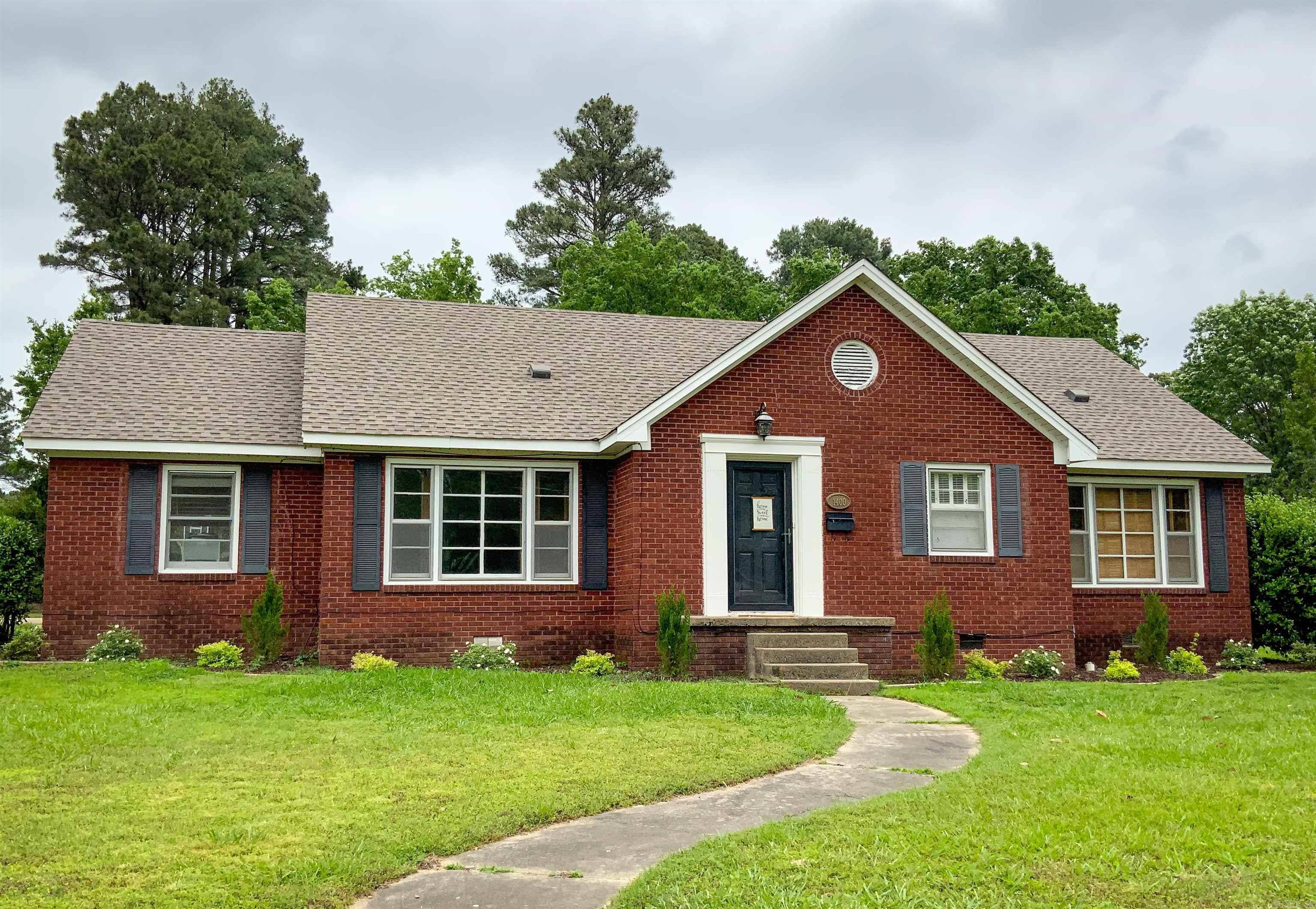 This beautifully maintained 3-bed, 2-bath home in Searcy offers comfort, charm, and thoughtful updates throughout. Recent improvements include fresh landscaping, interior paint, new weather stripping, and updated gas lines (2024). The hot water tank is just two years old, and an architectural roof was installed in 2020—offering peace of mind for years to come. Situated on a generous 0.42-acre lot, the backyard is a true highlight with a fun play area complete with swings and a slide, plus a gazebo that’s perfect for gatherings with a bit of TLC. Inside, you’ll enjoy hardwood and tile flooring, a well-equipped kitchen with a range and dishwasher, and a comfortable layout designed for everyday living. Tucked in a quiet, walkable neighborhood just minutes from local conveniences, the home is ideally located about half a mile from Harding University and close to White County Medical Center. Whether you’re a growing family, a student, a professor, or simply looking for a move-in-ready home in a great location, this one is a must-see.