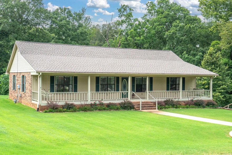 Country Retreat Awaits!  This beautiful home sits just a couple miles from town on 5.67 pristine acres.  Immaculate home with 3 large bedrooms, 2 baths, granite countertops in kitchen and baths, LVP flooring, spacious sunroom overlooking the tree line, 2 porches, office and laundry.  New HVAC and roof in 2020, 2 new water heaters in 2022; move in ready!