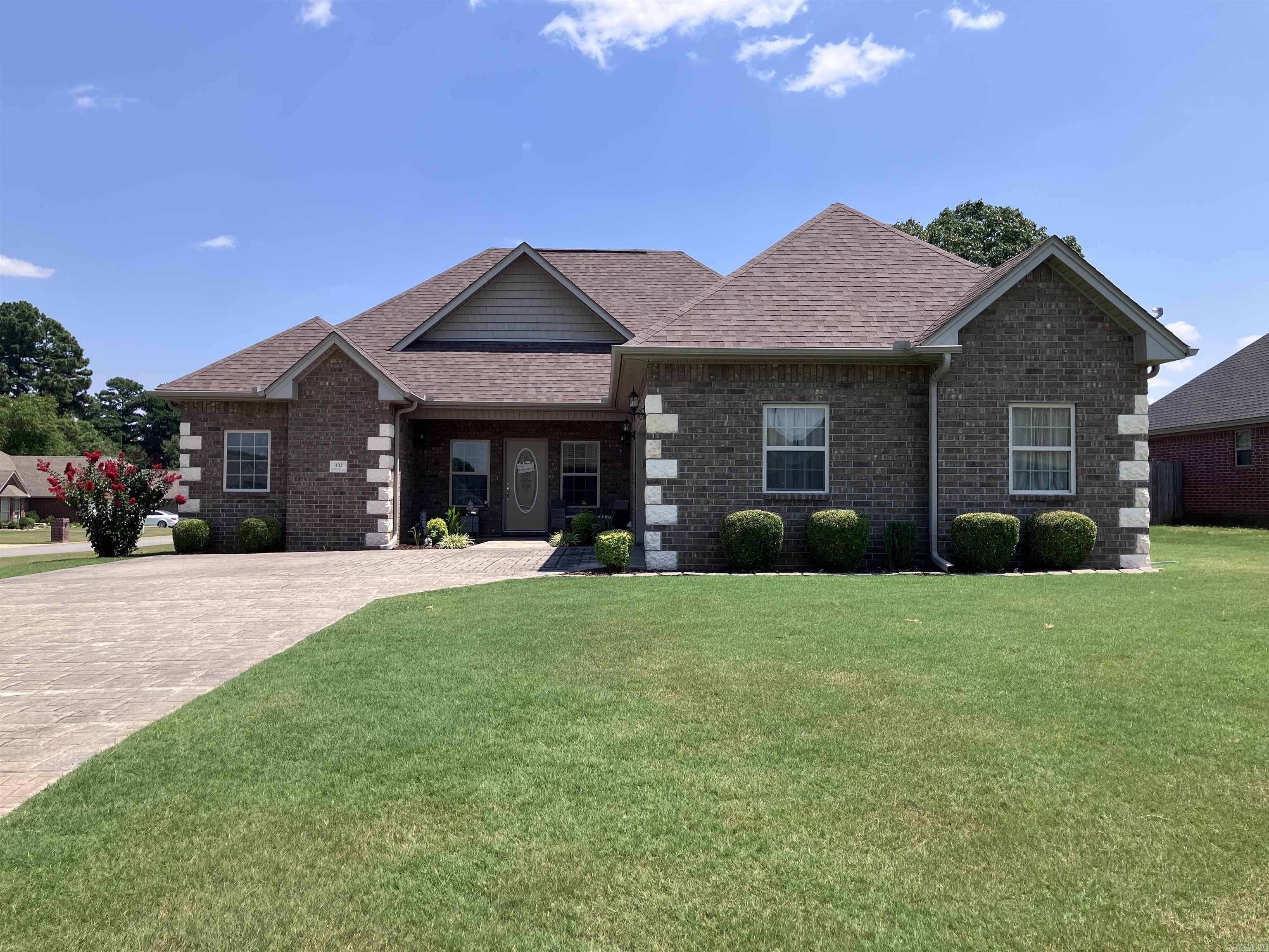 Beautiful 3-bedroom, 2-bath home situated on a spacious corner lot. This well-maintained, carpet-free home features 9-foot ceilings and elegant crown molding throughout. The kitchen and both bathrooms boast granite countertops, while the kitchen is complete with custom cabinets and a convenient pot-filler above the gas stove. The primary suite includes a walk-in closet that also serves as a storm-safe room, plus a luxurious bathroom with double vanities, a separate tiled shower, and a relaxing jetted tub. A generous laundry room offers plenty of storage and a utility sink. Washer and dryer will convey with the home. There is also a tankless gas water heater. Outside, the driveway is styled with a stamped cobblestone finish, and the backyard is fully privacy fenced with a large, covered patio perfect for entertaining.