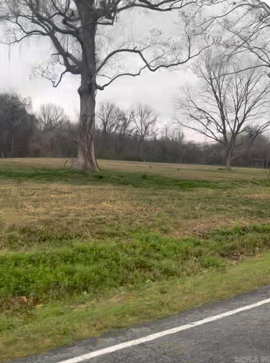 Rare opportunity to own 8 +/- acres of flat buildable land in beautiful Scott, Arkansas.  Prime opportunity to subdivide in a peaceful rural setting.  Utilities are available and the property is near Old River Lake, but no lake access.  Paved road and subdivision potential. Enjoy country living while still being conveniently located to Little Rock/North Little Rock and amenities.  Opportunities like this don't come along often.  This acreage is hard to find.  Priced to sell all 8+/- acres or can subdivide for what you need.  Come see today.  Look for signs and stakes with red ribbon.  Notice diagram on pictures for exact location.