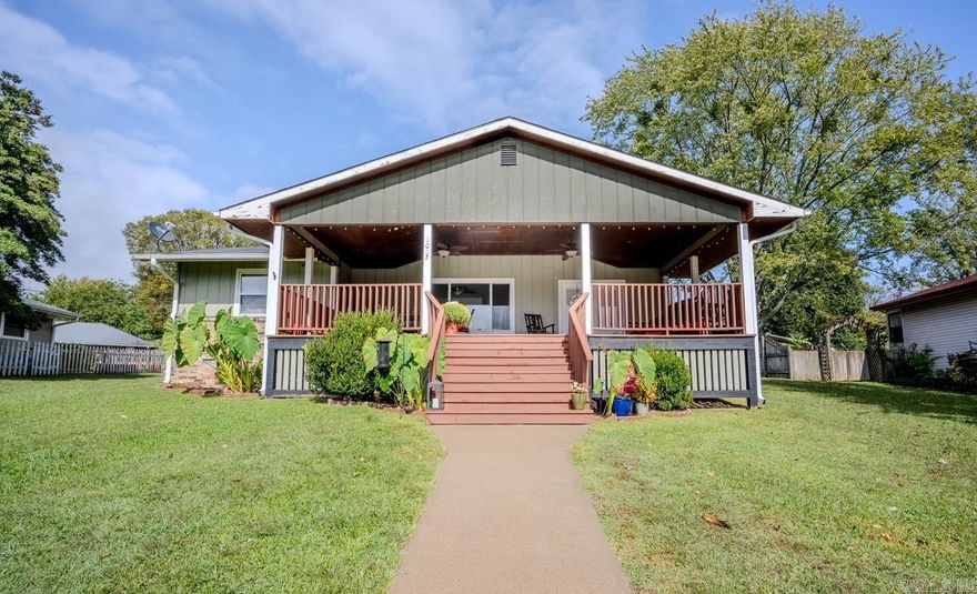 Welcome to Paradise overlooking beautiful Cox Lake located at 1007 Lakeside Drive. Call this beauty your Forever home.. Air BnB.. Vacation home with many updates inside and out New Roof & Gutters in 2022 Enjoy entertaining family and friends on the large 458 sq ft covered deck while overlooking the lake. Step inside this spacious home with many updates, new large granite bar, stainless appliances, pantry/ utility room. Large bedrooms and closets, plus a sunroom perfect for an office.  Storage in garage, fenced back yard offering wooden privacy fencing.