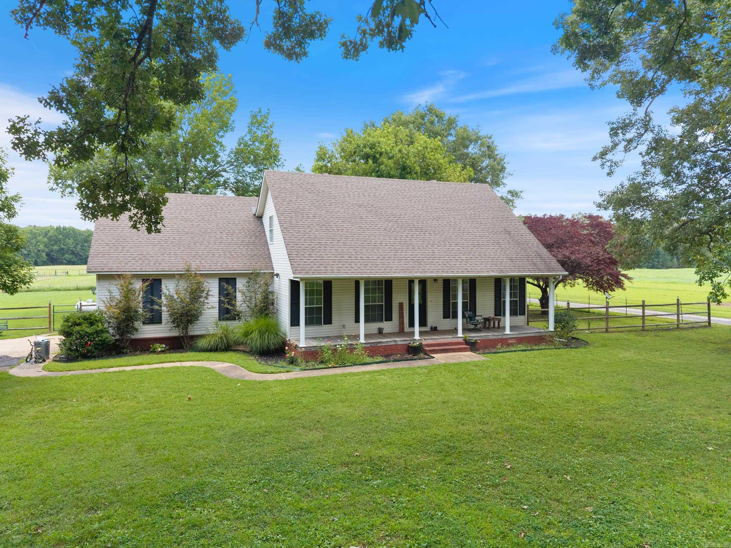 This charming property is fully fenced and cross-fenced—perfect for your mini farm dreams! It includes a small barn and plenty of space for animals or gardening. The home welcomes you with a lovely front porch and a spacious living area. The kitchen includes a cozy breakfast nook, and there’s an additional flex room that could serve as a formal dining room, home office, 4th bedroom or playroom. The main bedroom is located on the main level and features a beautifully updated bathroom with a walk-in shower. Upstairs, you’ll find two more bedrooms and a full bath, along with recently updated flooring. Additional features include a two-car garage and ample outdoor parking. This is the ideal setup for peaceful country living with functional space inside and out!