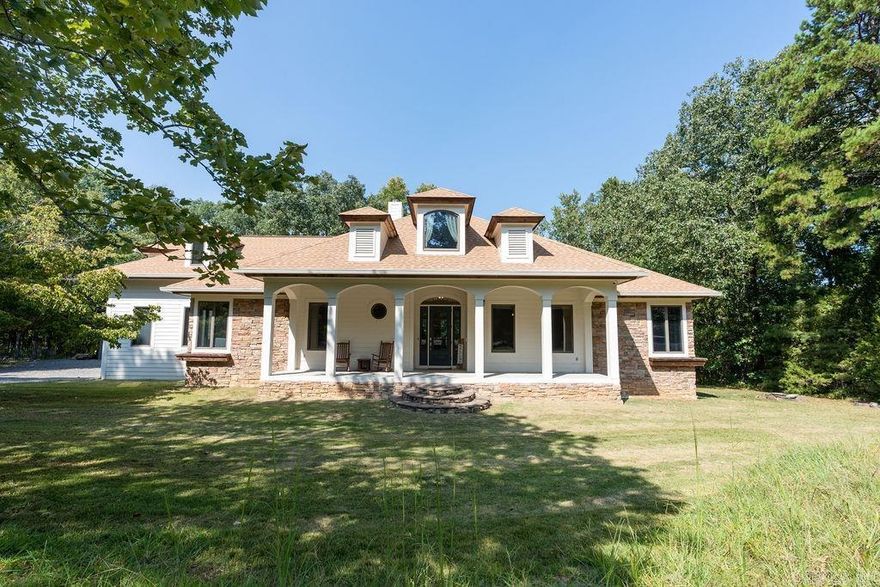 Beautiful LAKEFRONT home in Twin Cove Estates with PRIVATE 2-SLIP DOCK W/LIFTS. This well-maintained home has soaring ceilings, an open floor plan, four bedrooms and three full baths. Walk down the stone steps to the dock or just sit and enjoy the long covered porches on both the front and back of the house. Gorgeous views summer & winter. Large detached shop, 2 garage doors, roughed in for plumbing for apartment. Gameroom/garage attached to house.