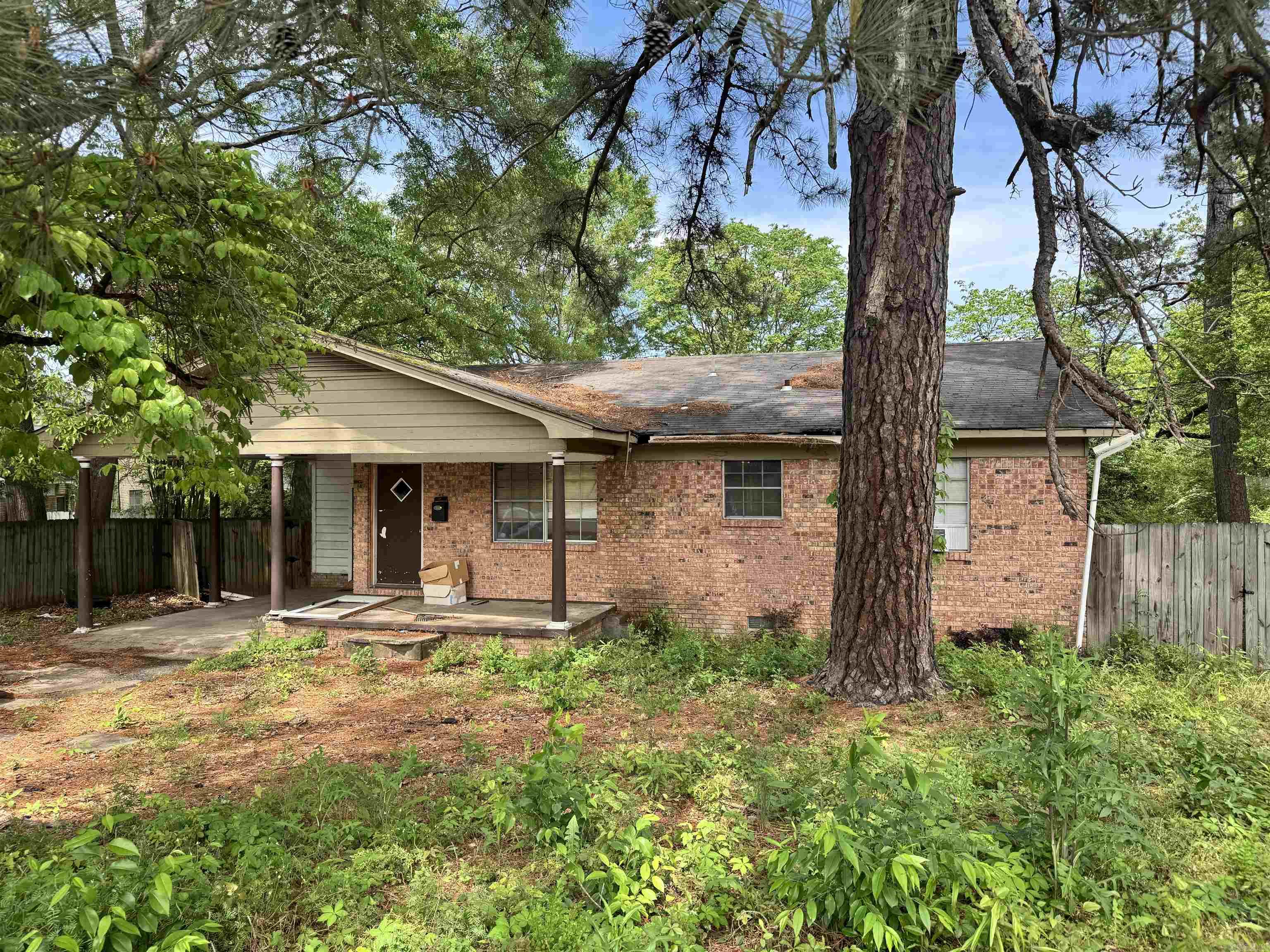 Investor Alert! This home sits in an adorable neighborhood. 3 bedrooms and 2 full baths. Large kitchen and living areas. Large fenced back yard. Outdoor storage room. Covered carport. It does need repairs to include roof, soffit and facia, ceilings and flooring. **do not enter primary bathroom as water has caused flooring to decay** Utilities are not on and will not be turned on by seller. Bring all offers! No sellers disclosure as seller has never occupied property. Buyer to verify property taxes.