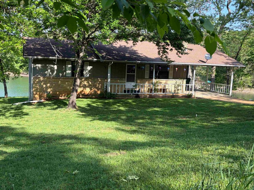 Bellissima! Beautiful is what comes to mind with this 2-bedroom, 3 full bath lakefront home. Imagine looking out the kitchen window with a cup of coffee in hand and seeing Pioneer Lake. Or sitting on the covered porch and watching the sunset over the lake. The two bedrooms and two of the full baths are located on the main floor. The open living room features a beautiful wood burning fireplace and sliding glass door in the dining area so you can see the lake. But wait there’s more. The full finished basement also has a wood burning fireplace, a full bath and plenty of room to make an additional bedroom. It also has a sliding glass door to walk out to the lake and do the ice bath challenge then run back in and sit in the sauna to warm back up. Yes, I said sauna. There is also plenty of storage space in the workshop and you can walk under the crawl space. More storage. Septic system is new. But don’t bring your gas-powered boats, this lake is pristine and only man or electric power allowed. Crown Lake up the road has a marina for your gas-powered boat. The city also has a golf course. This area is the best kept secret in the Ozarks. Call me today for your private viewing.