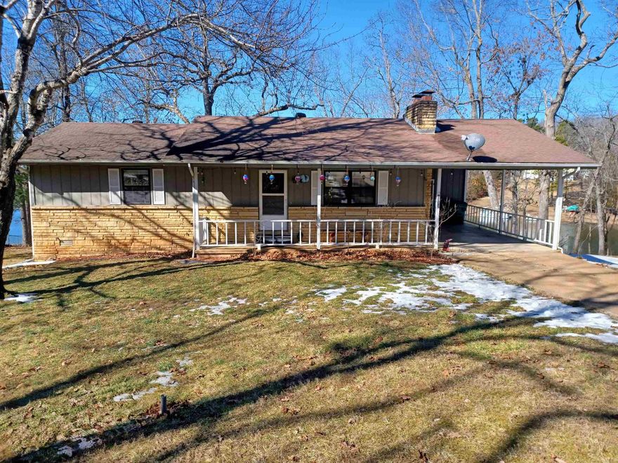 Bellissima! Beautiful is what comes to mind with this 2-bedroom, 3 full bath lakefront home. Imagine looking out the kitchen window with a cup of coffee in hand and seeing Pioneer Lake. Or sitting on the covered porch and watching the sunset over the lake. The two bedrooms and two of the full baths are located on the main floor. The open living room features a beautiful wood burning fireplace and sliding glass door in the dining area so you can see the lake. But wait there’s more. The full finished basement also has a wood burning fireplace, a full bath and plenty of room to make an additional bedroom. It also has a sliding glass door to walk out to the lake and do the ice bath challenge then run back in and sit in the sauna to warm back up. Yes, I said sauna. There is also plenty of storage space in the workshop and you can walk under the crawl space. More storage. Septic system is new. But don’t bring your gas-powered boats, this lake is pristine and only man or electric power allowed. Crown Lake up the road has a marina for your gas-powered boat. The city also has a golf course. This area is the best kept secret in the Ozarks. Call me today for your private viewing.