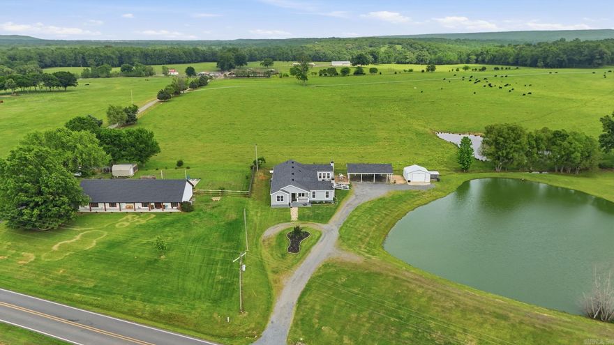 Welcome to this beautifully maintained 6-bedroom, 3.5-bath home on 3.72 acres. The property backs up to a massive open field that makes it feel like you're surrounded by endless space to breathe. Step onto the back deck, look out over the stocked pond, and take in wide open sky and rolling green as far as you can see. Inside, two living areas with wood burning fireplaces give you room to spread out, with abundant storage and closet space throughout. The home has been thoughtfully updated with fresh paint inside and out, new flooring, a new roof, LeafFilter gutters, updated decks, and two HVAC units replaced in 2019. Outside, a covered porch and large deck overlook the pond and that incredible open backdrop. Fresh flower beds and a garden ready to plant round out the outdoor living. A 3-car carport, detached garage/shop with upper level storage, and an additional shop gives you all the space you need for hobbies, tools, and toys. This home also has space for an in-law quarters for multi generation living! Peace, privacy, & modern updates on nearly 4 acres. This is country living done right. Properties like this are rare, so schedule a showing and make it your next chapter now!