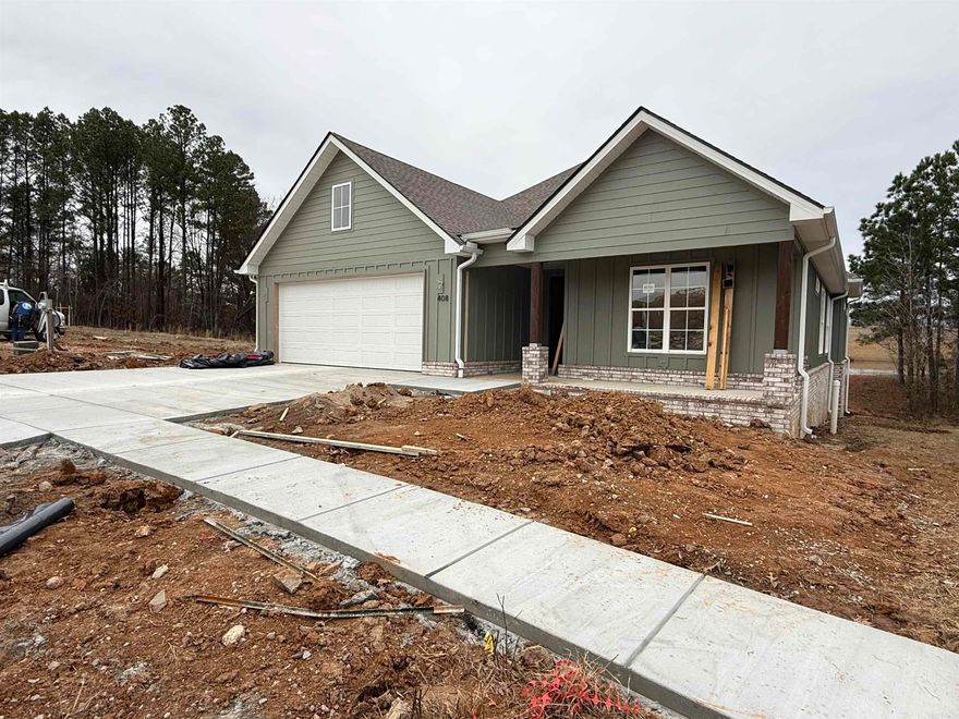 Take a look at this beautiful Craftsman-style home situated in a highly sought-after neighborhood in Bryant! You'll find custom designer touches throughout the residence, creating a perfect mix of elegance and functionality. Its excellent location also means you're just a short walk away from the neighborhood pool.  Picture yourself unwinding on the inviting front porch and taking advantage of the local weekend farmers market. This home boasts a thoughtfully designed layout with an open kitchen and living room filled with natural light, all while backing up to a secluded greenbelt and a spacious backyard.  Come see it today!