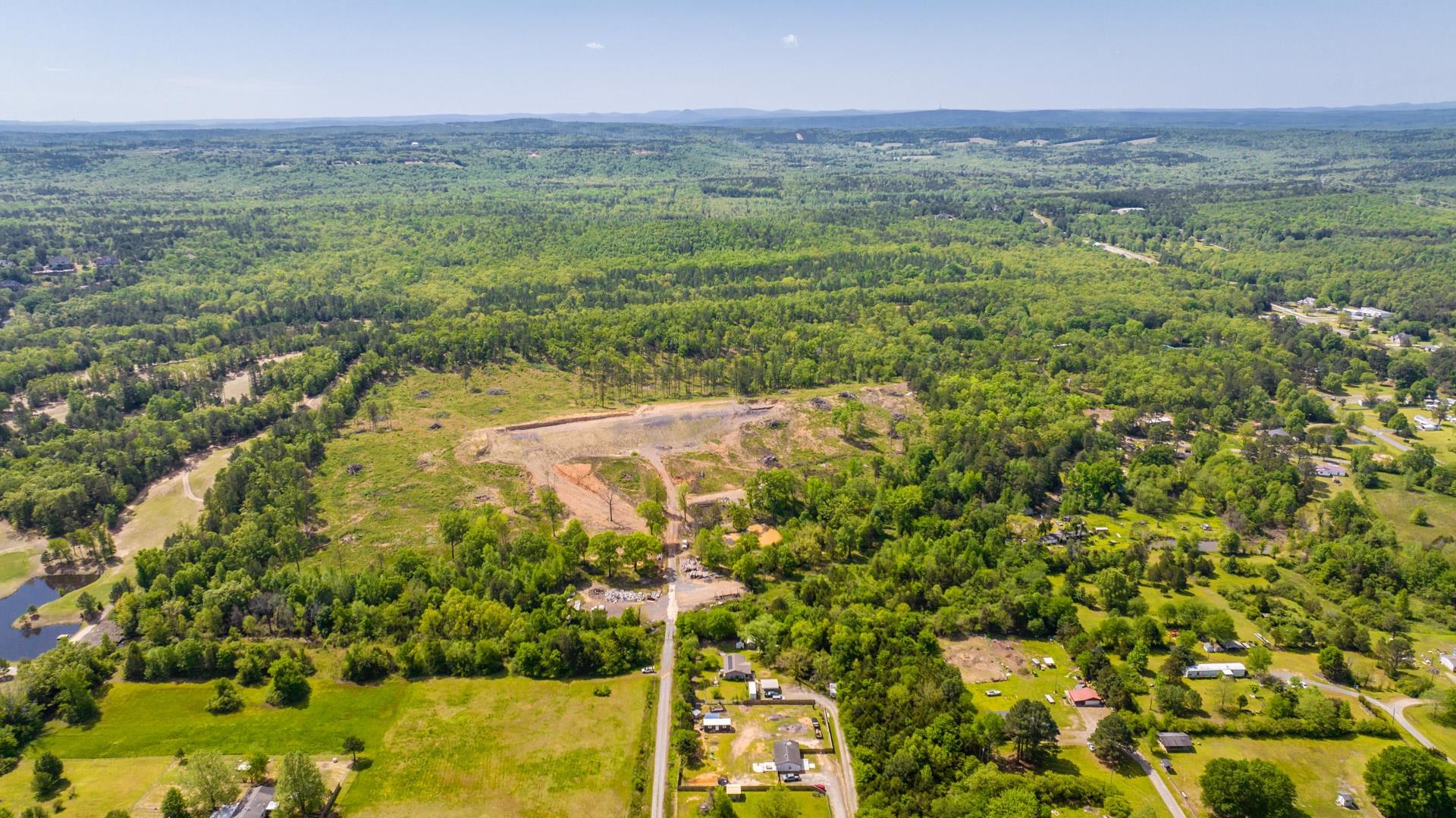 Discover an exceptional development opportunity with this sprawling 64-acre property, perfectly zoned for single-family homes or duplexes. This prime real estate offers a total of 154 lots, ready to be transformed into a vibrant community. Key features include: - **Infrastructure in Progress**: The first phase has commenced, with roads currently being cut and all manholes already on site. - **Onsite Resources**: All necessary shale for the entire development is conveniently on the premises. - **Convenient Access**: The property boasts two entrances for easy ingress and egress. - **Breathtaking Views**: Enjoy incredible vistas that enhance the appeal of this remarkable location. - **Detailed Planning**: Plat plans are available, providing a comprehensive view of the development potential. This is a rare chance to invest in a well-prepared site with significant groundwork already underway. Don't miss the opportunity to bring this visionary project to life.