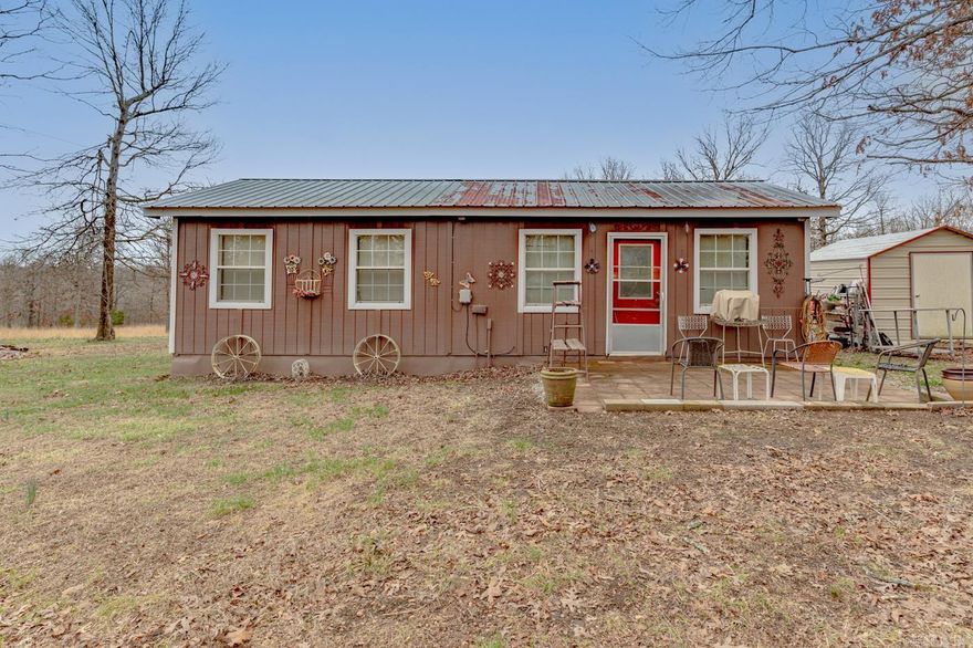 Welcome to 171 Dry Bone Rd in Ash Flat, Arkansas, located in Sharp County and sitting on 5.5+\- acres of cleared, level land offering privacy, space, and peaceful country living. Built in 2015, this 1 bedroom, 1 bathroom home with 576 square feet features wood siding, a durable metal roof, and a large driveway with plenty of parking space. Inside you’ll find a functional layout with a kitchen equipped with a stove and built-in microwave, along with a separate laundry room for added convenience. The property also includes two storage buildings (10x8 and 10x12), one featuring a loft for additional storage. Whether you’re looking for a weekend getaway, hunting cabin, rental investment, or a simple place to downsize, this property offers plenty of flexibility with fiber internet available and acreage ready for your vision. Call today to schedule your tour!