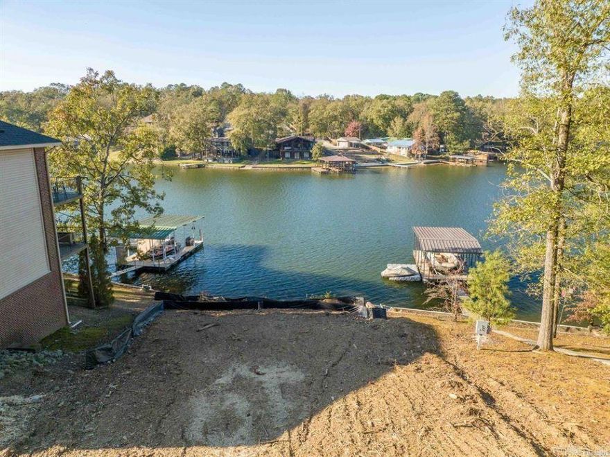 Affordable lake lot on Lake Hamilton with a boat dock. The lot is cleared and ready for you to build your dream home on Lake Hamilton!50 ft +/-of frontage. Established, quiet neighborhood. Located only minutes from bypass.