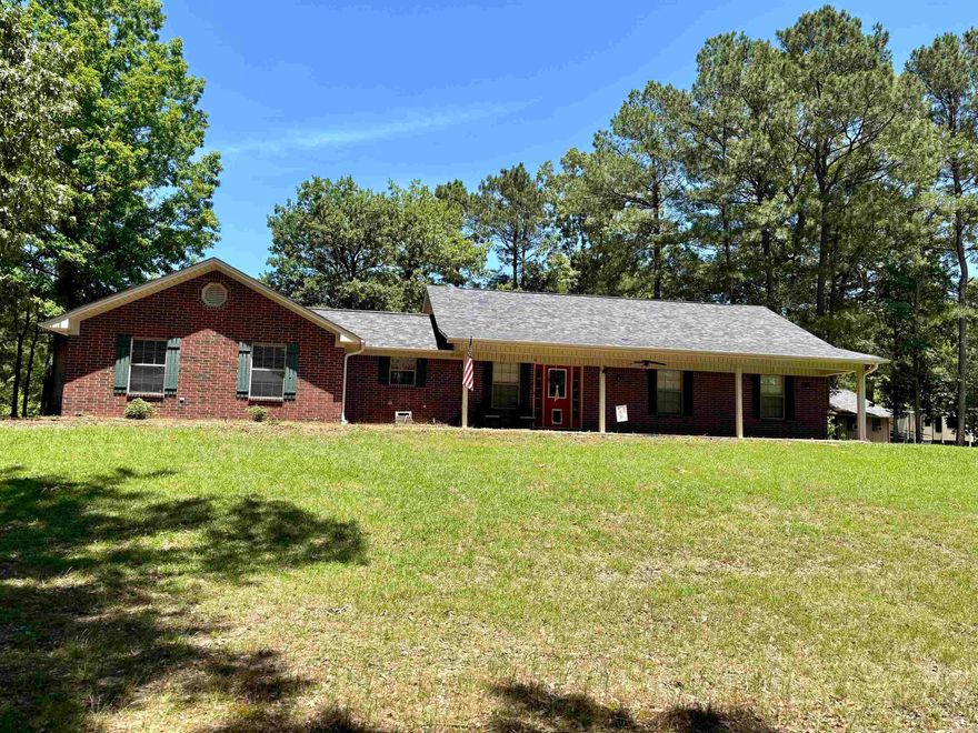 Ranch-style 3-bedroom, 2-bathroom home located outside the city limits of Dierks, AR, offering approximately 1,500± square feet of living space on 20.77± acres. This well-maintained home features a functional floor plan, a two-car garage, and an outdoor storage building/workshop. Additional amenities include an RV hookup and a mix of open and wooded land, offering a variety of potential uses. Shown by appointment.