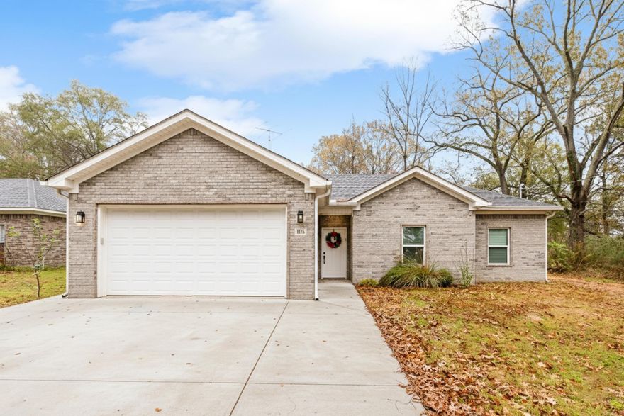 This beautiful all brick home blends modern design with everyday comfort. It offers stone countertops in kitchen and bathrooms, an open floor plan, wood cabinetry and soft close drawers and doors. Conveniently located near the heart of Benton, this home provides easy access to shopping, dining, schools and highway access. Inside you'll find 3 bedrooms and 2 full baths. Closets have builtins and primary suite features a generous walk-in closet. The living area is spacious, bright and airy, filled with natural light from large windows. Kitchen features center island with a  deep sink, whirlpool dishwasher, abundant cabinetry and a walk in pantry. Additional storage is available in the floored attic above the garage.  Outside, you'll love the large private back yard that backs up to greenspace, offering peace and privacy while still being located in town! Additional concrete has been added to the driveway for extended parking space. This home offers so much at an affordable price!