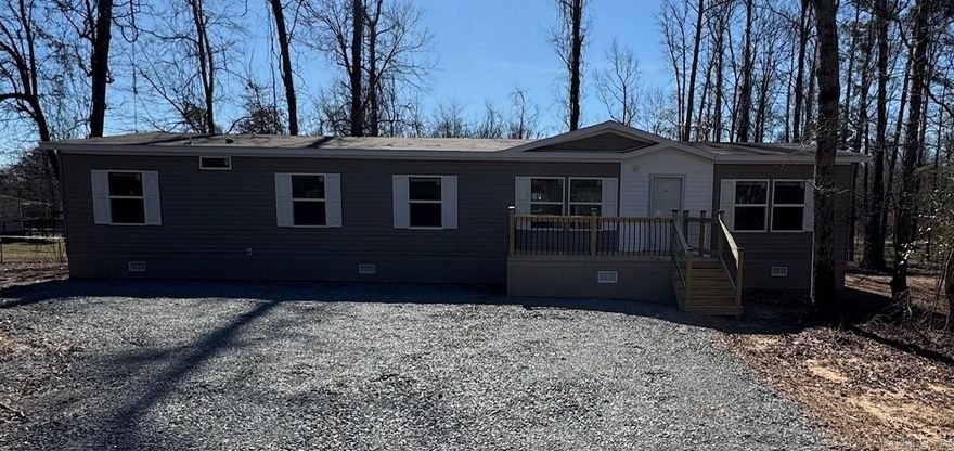 THIS HOME QUALIFIES FOR $0.00 DOWN USDA LOAN.  We have lenders offering low rates and buy down points on this home.     4 bedroom 2 bath Brand new manufactured home on 1.67 acres. All new appliances, new underpinning, new heat pump, new water lines, septic, electric. front and back decks. Home is on a permanent foundation.  Home is energy smart and comes with a 1 year manufactured home warranty from the dealership. All service will be taken care with the service dept at the local dealership.  Be the first family to call this beautiful home yours! Call Listing agent to schedule a private showing today. hurry before this one is gone.