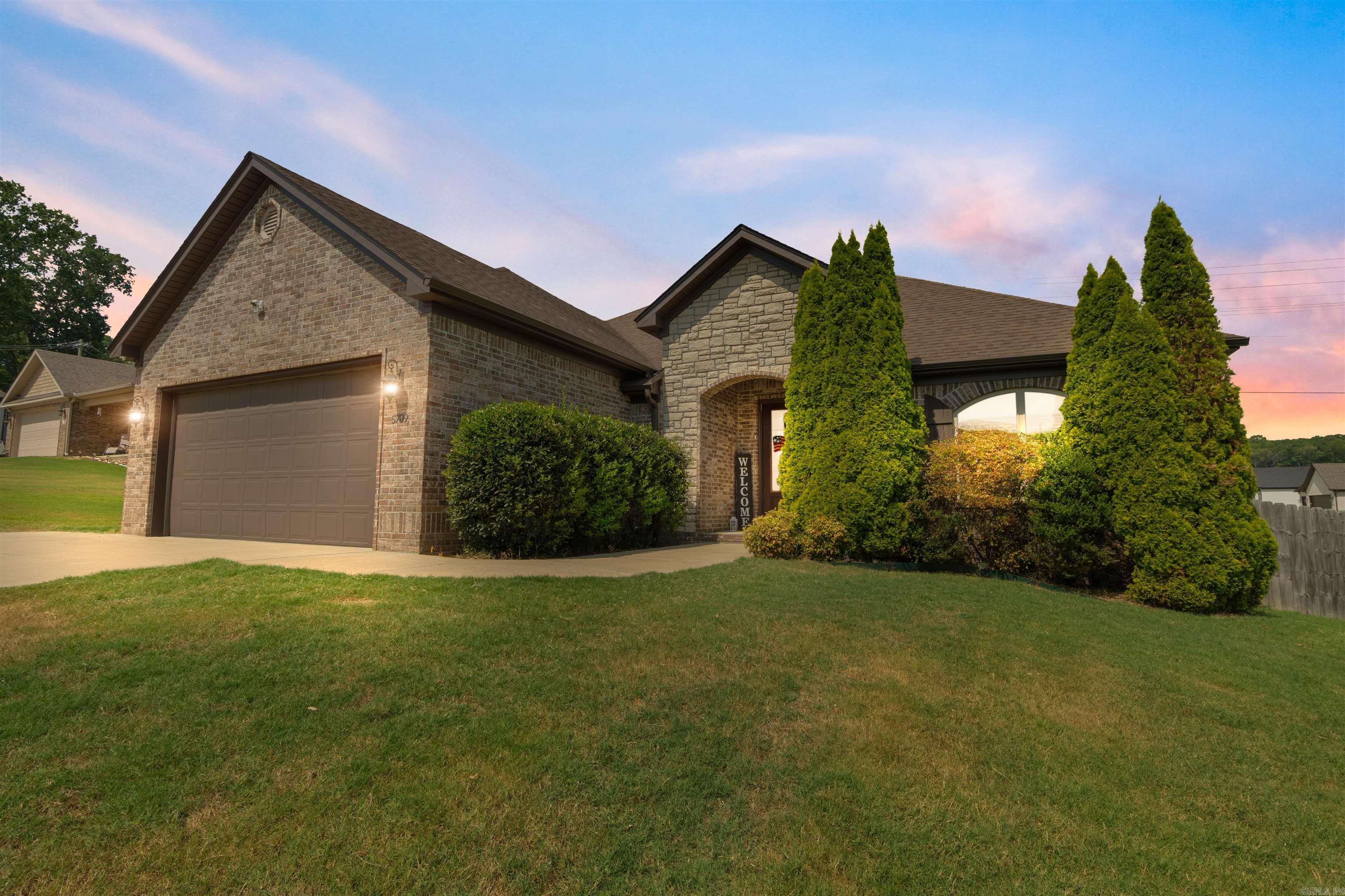 ***All-Brick Beauty w/ Brand New Roof in Bryant*** Custom-built 1 owner home featuring over 2000 SF 3 beds/2 baths on the main level plus a flex room and half bath upstairsāideal for 4th bedroom or office. Soaring 12' ceilings, rich crown molding, built-ins, and a cozy gas fireplace set the tone in the living space. Kitchen features granite countertops, stainless steel appliances, custom cabinetry, and a HUGE walk-in pantry. Mudroom with built-in cubbies, spacious laundry with direct access to the XL walk "through" closet of the primary suite. Engineered wood floors flow through living, kitchen, & dining with ceramic tile in wet areas. The covered back porch is perfect for calling the hogs with the mounted TV that will convey. HVAC serviced twice annually, separate mini split unit for upstairs. Storage GALORE including floored walk-in attic space, multiple closets, tool organizer in garage and more. Gutters, French drain and fully fenced backyard, EXTRA driveway parking spot, outside storage building and security system. Lots of custom upgrades inside and out. Minutes from I-30, Bryant Schools, and all the conveniences of Springhill and Bryant Pkwy!
