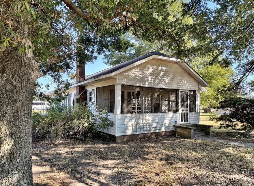 Welcome to Market 600 Lake Street in Lake City, Arkansas.  This charming home features three bedrooms and one bathroom, along with separate dining and laundry rooms. Whether you enjoy curling up by the fireplace or unwinding on the porch swing in your screened-in porch, you’ll find ample space to relax. Nestled on a generous half-acre corner lot, this property features mature trees that offer plenty of shade for enjoying outdoor activities. A large carport and storage building enhance the convenience of this lovely residence. Don’t miss out—call today to schedule your tour!