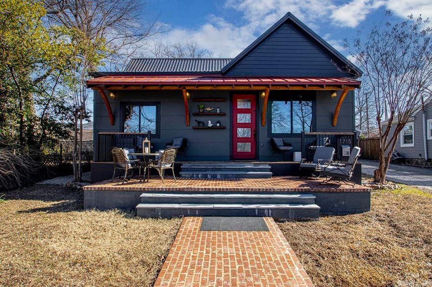 One of a kind Heights home that has been completely remodeled and expanded.  This rustic modern design is a one level 3 bed 2.5 bath. The owner has touched every surface and given much thought to the design and functional layout.  10' ceilings, original hardwood floors refinished and cut to lay in herringbone pattern.  Metal roof with solar panels, foam insulation, and low e windows and doors make this a super energy efficient home. Super cool second living area with functional glass garage door, great room, and knockout kitchen with high end appliances this is a great house for all! Walk outside to porches, patios, great landscaping, and rear parking complete with even an EV power plug!