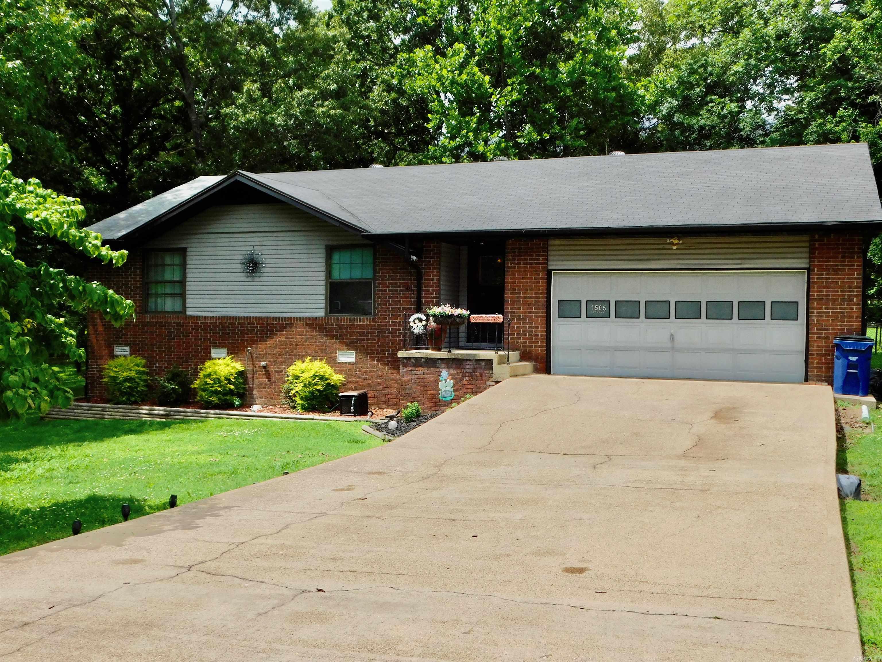 Charming 3 bed, 2 bath brick & vinyl home in desirable Carlile Highlands Subdivision with 1,666 sq ft of stylish living space. Spacious primary suite features large walk-in closet and French doors leading to a heated/cooled sunroom w/lots of natural light. Enjoy cozy evenings in the living room with a brick wood-burning fireplace. Kitchen offers pantry, skylight, newer stainless-steel appliances, new LVP flooring, updated sink, and countertops. Step outside to a freshly painted large deck overlooking a private backyardāperfect for entertaining. Tastefully landscaped, well-maintained gem offering comfort, warmth, and modern updates throughout. Minutes to lake, rivers, hospital, restaurants and coming soon Sports Complex.