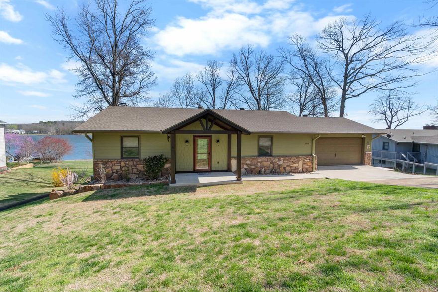 Beautiful, well maintained lakefront home offering the perfect blend of comfort, space, and scenic views! The home has been completely updated inside & out along with a NEW Central heating/air system installed March 2026. This 3 bedroom, 2 bathroom home features an inviting open floor plan on the main level, with a wood-burning fireplace. The kitchen has custom cabinetry with granite countertops, stainless steel appliances, and a pantry. The main floor also includes two spacious bedrooms with a full bathroom between for easy access. Downstairs, the walk-out basement provides additional living space with a second living area, a third bedroom, and a full bathroom. Step outside and enjoy lake living at its best with decks on both levels, perfect for entertaining or soaking in the views. With easy access down to the water, this property is ready for you to enjoy everything lake life has to offer.