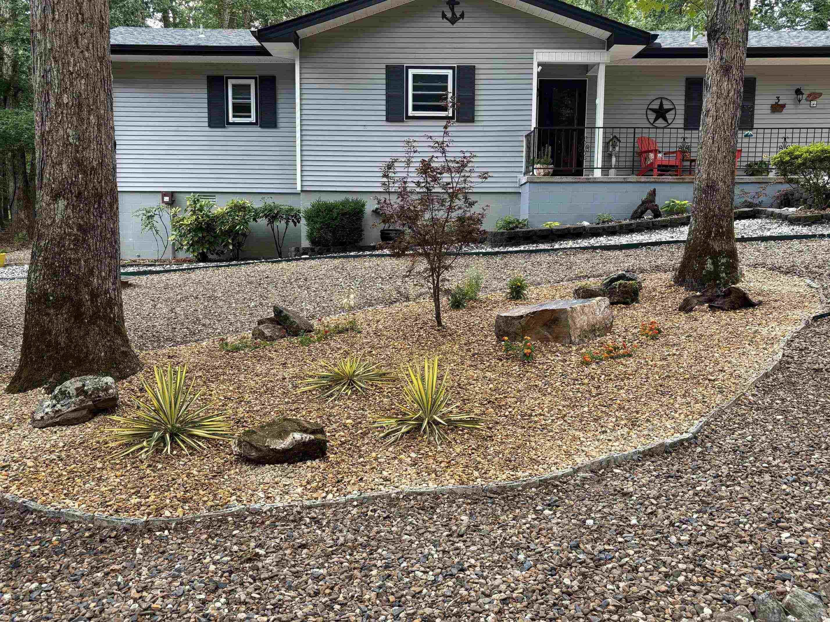 Discover this Charming 2-bedroom, 2-bath home in the heart of the gated 26,000-acre Hot Springs Village community. This partially furnished gem boasts modern upgrades, a newly landscaped and fenced-in yard, and a serene setting perfect for comfortable living and entertaining. Kitchen features elegant maple cabinetry with pull-out drawers, granite countertops, tile flooring, and stainless steel appliances, including a stove (2022) and dishwasher (2018). The living room showcases a ventless propane stove set against a fire-rated faux brick wall, creating a cozy ambiance. The adjacent dining room, ideal for gatherings, opens to a bright sunroom. This home offers access to a vibrant community with endless amenities, including golf courses, lakes, trails, pickleball and more! Experience the perfect blend of modern comfort and natural beauty in this move-in-ready retreat. New HSV homeowners subject to $2000. buy in fee. AGENTS SEE REMARKS!!