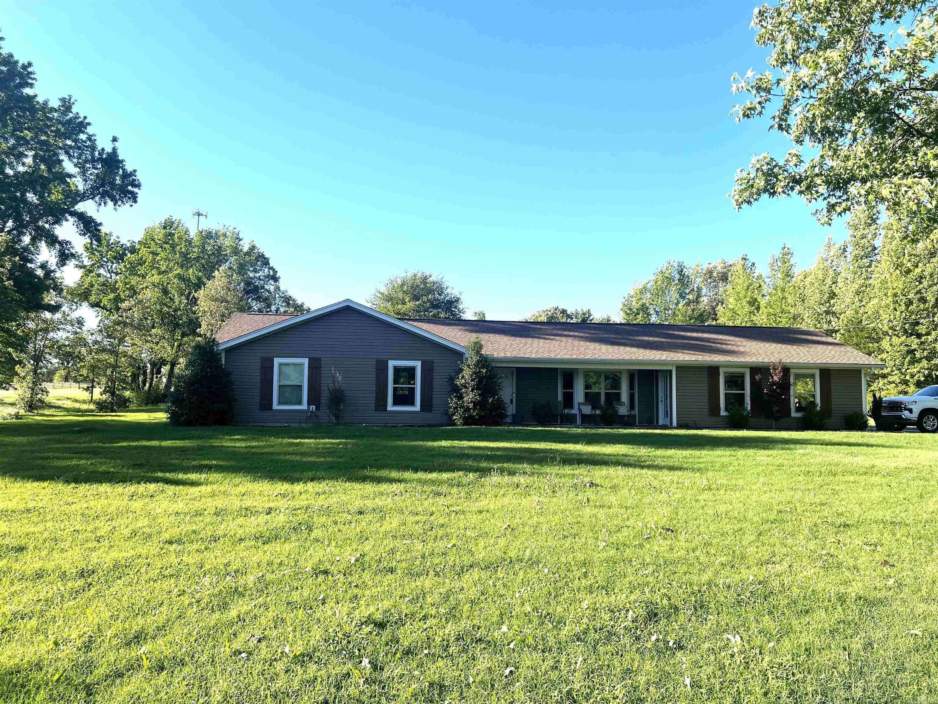 PRICE IMPROVEMENT!! Looking for property close to the city but far enough away to enjoy privacy? Enjoy peaceful living on just over 2 acres of privacy. The home boasts 1654 sq ft of comfortable living space, featuring an open concept layout perfect for effortless entertaining and everyday living. Unwind on the back patio under the covered gazebo, ideal for outdoor gatherings or quiet moments. Recent whole house complete renovations bring modern charm to this tranquil retreat. Schedule a showing today and make this ideal quiet living yours!