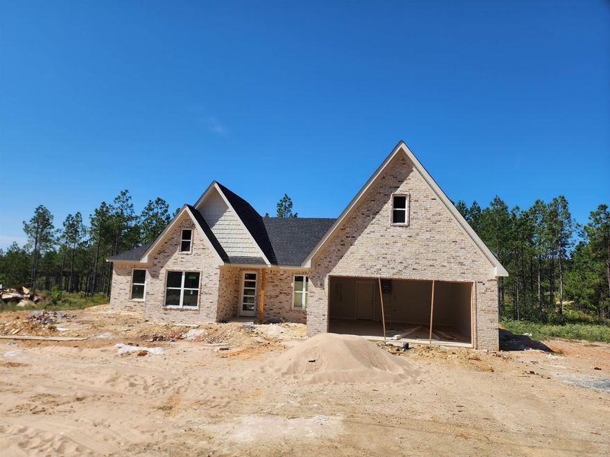 Timber Wood subdivision is close to town but far enough away to have some land. Modern country all brick home sits on 1.45 acres with 2250 square feet of living space. This home offers a spa like Primary bathroom with a freestanding tub and large shower. Primary closet flows to the laundry room. Living room has brick fireplace from floor to ceiling and leads to the kitchen with a large kitchen island and chefs pantry. You will want to see this home.