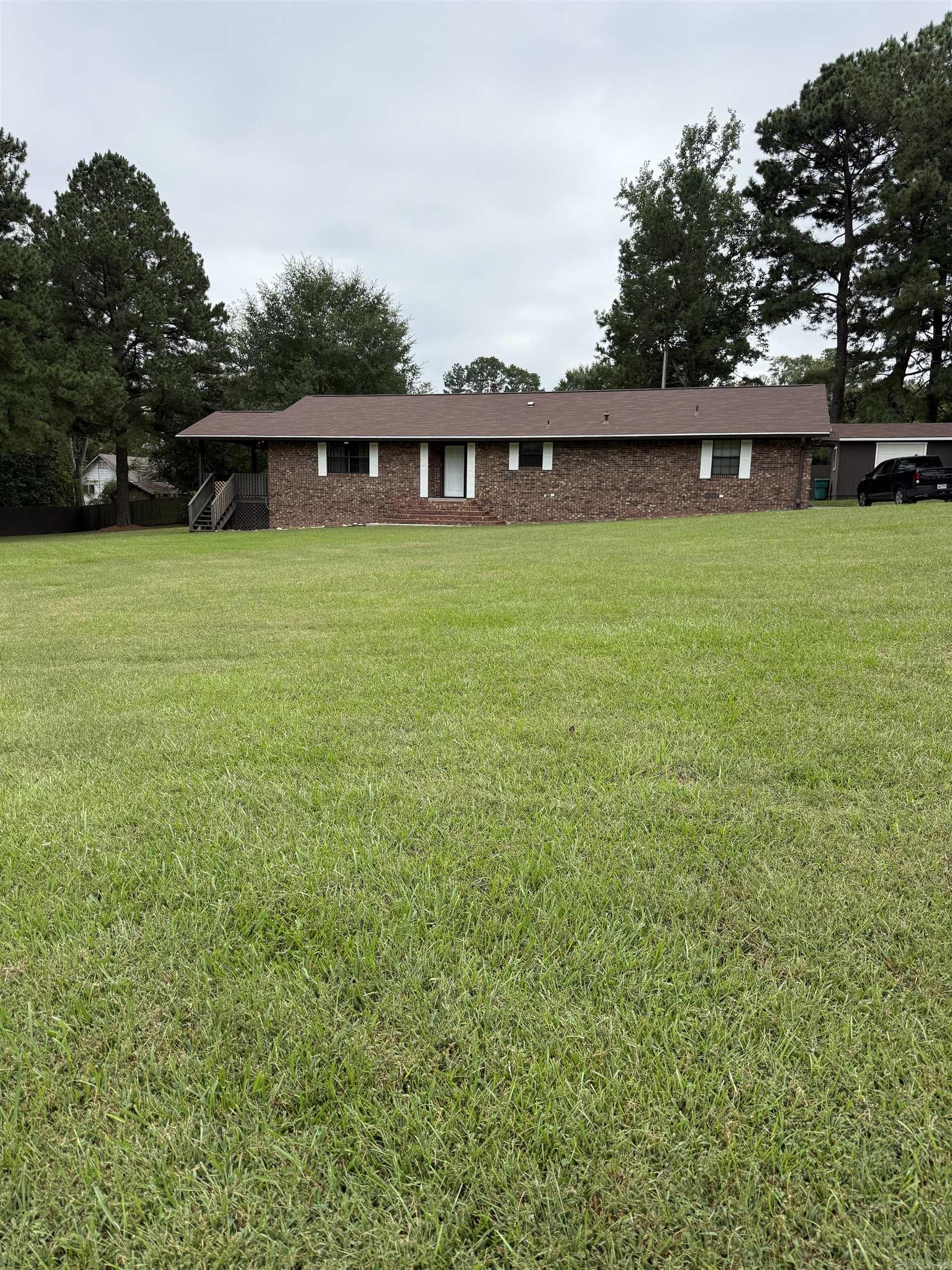 Brick home located in the heart of Nashville, offers over 1,800 sq ft of living space. 2 bedrooms and 2 full baths, large living room, spacious kitchen with lots of storage, wall oven, electric stove top, dishwasher and new refrigerator to convey, separate laundry room with tank-less gas hot water heater, family room or den can be utilized in many ways with large storage closet. 12x16 utility building with attached covered parking pad, new roof in May 2024, new leaf guard gutter system in 2025, new carpet in 2025. Home is move in ready.