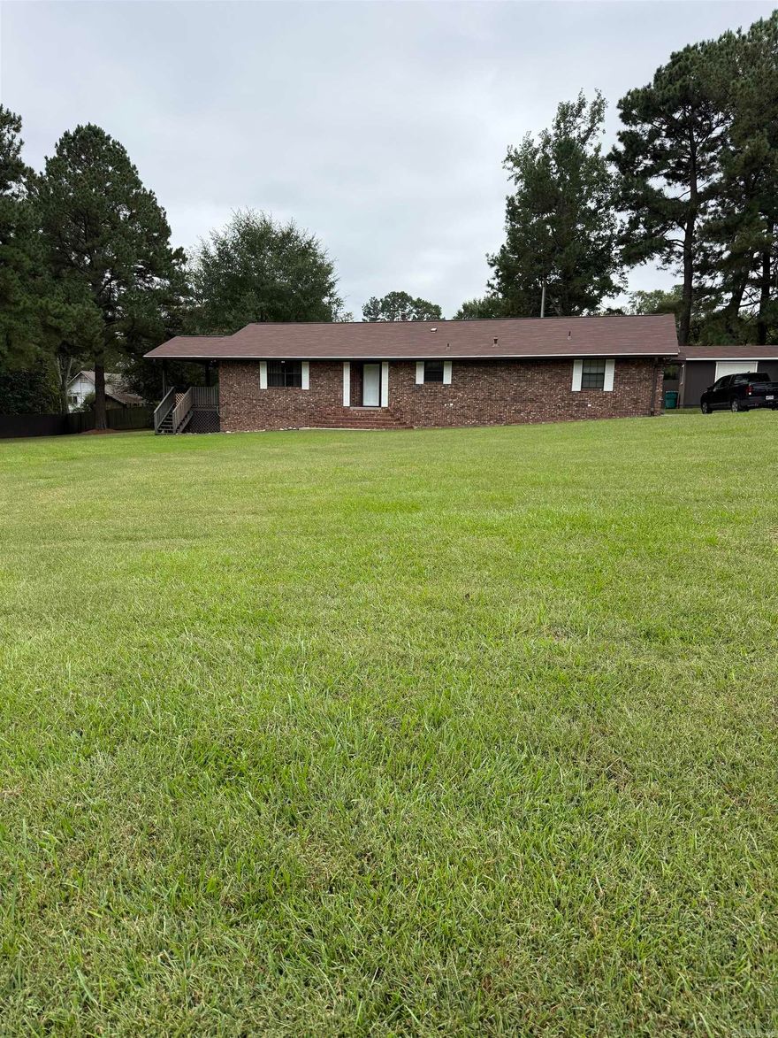 Brick home located in the heart of Nashville, offers over 1,800 sq ft of living space.  2 bedrooms and 2 full baths, large living room, spacious kitchen with lots of storage, wall oven, electric stove top, dishwasher and new refrigerator to convey, separate laundry room with tank-less gas hot water heater, family room or den can be utilized in many ways with large storage closet.  12x16 utility building with attached covered parking pad, new roof in May 2024, new leaf guard gutter system in 2025, new carpet in 2025.  Home is move in ready.