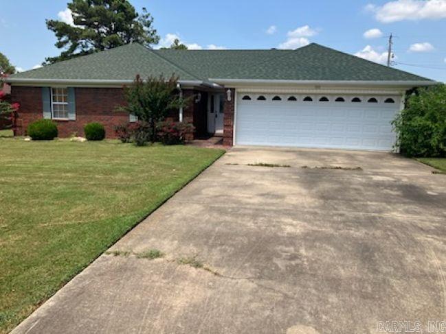 3 Bedroom, 2 bath, all brick, all electric home in the heart of Carlisle, on a nice corner lot. Primary suite features walk-in tub/shower combo. 2 car garage. Refrigerator conveys. AGENTS, SEE REMARKS.
