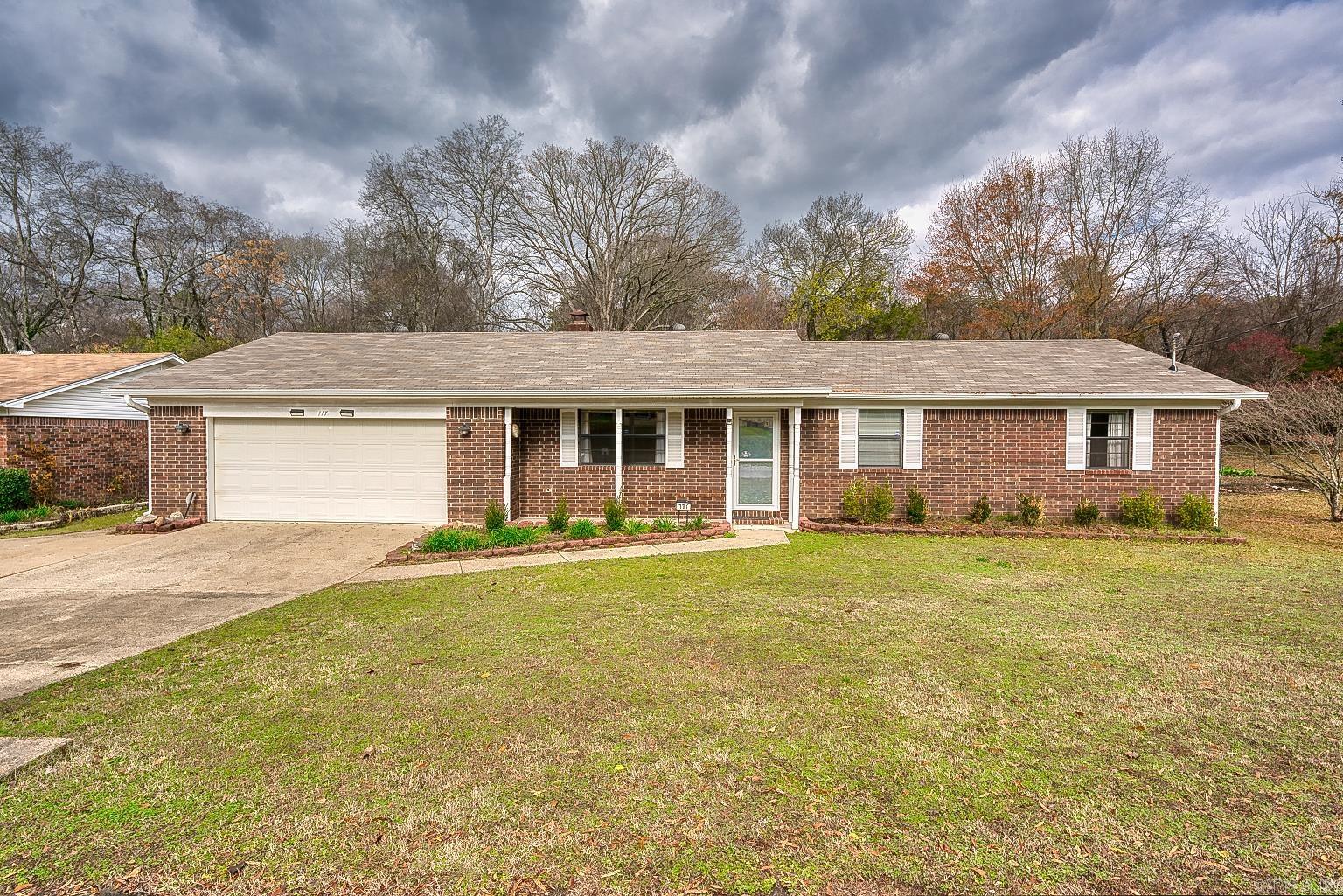 Welcome to this adorable 3-bedroom, 2-bathroom home in the heart of Hot Springs! As cute as a dollhouse, this property is packed with modern updates and thoughtful features. The kitchen shines with stainless steel appliances, Corian countertops, and ample cabinetry. A 2023 roof provides peace of mind, while the oversized 2-car garage offers extra storage space and convenience. The exterior boasts a spacious, level yard perfect for outdoor activities, a huge deck for entertaining, and a 24x16, two-story shop ideal for hobbies, storage, or a workspace. Situated near everything the city has to offer, this home combines charm, practicality, and a fantastic location. Don’t miss your chance to own this gem—schedule your showing today