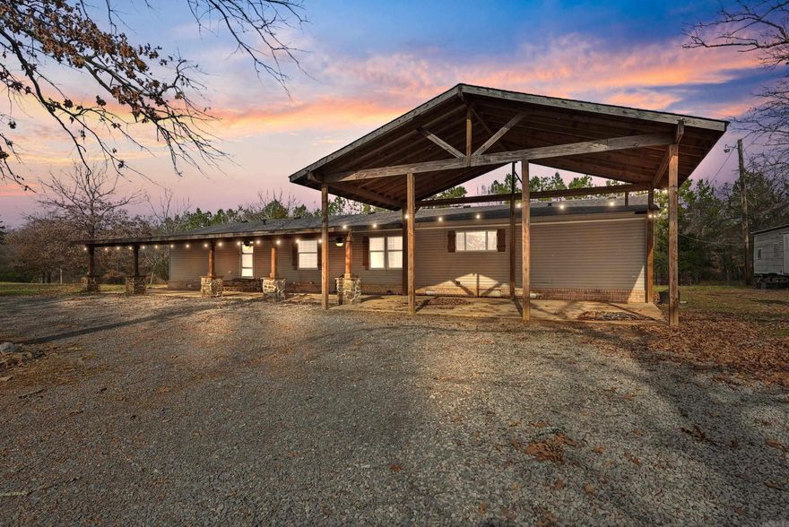 Beautiful homesite on almost 10 acres! If you are looking for the perfect country home with space to roam but still close to town, this is it!  All for under $300k!.  The open floor plan mobile home has tons of space.  4 bed/2 baths with a large bonus room that could be used as a 5th bedroom, office, playroom, workout room, media room, and more.  Nice kitchen with pantry, kitchen island, and butler pantry area, great for large gatherings.  Refrigerator conveys.  The living room looks out onto the covered front porch, in-ground pool, and deck.  Just off the back of the home you'll find an in-ground storm shelter.  Out back you'll find a cozy fire pit with 5 swings surrounding it.  Hook-up for RV is on the property.  Theres an older barn with stalls and that could be used for livestock or storage. Fenced for livestock, the land spreads out over two parcels that total almost 10 acres. Easy access to the Little Rock Air Force Base, Vilonia, Conway, Cabot, and Little Rock.